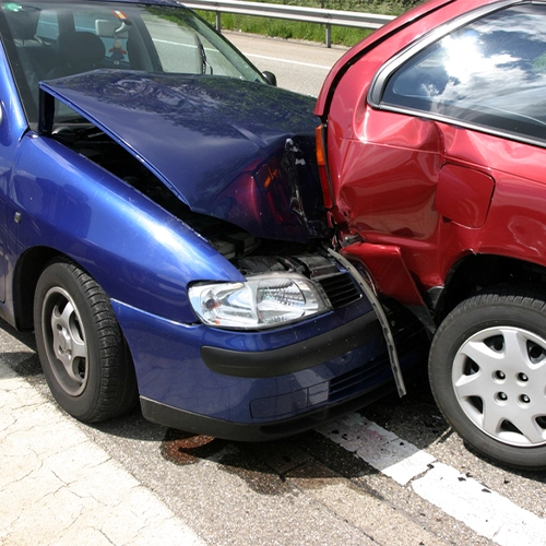 Red And Blue Car In An Accident